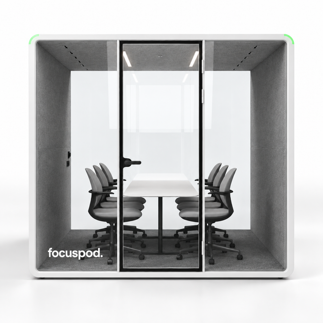 FocusPod Max front studio view with optional six-chair meeting furniture package and white logo low on the left glass.