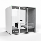 FocusPod Meet front-left angled studio view showing its deep side profile and optional furniture.