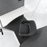 Top-down interior view of FocusPod Solo Plus showing the optional ergonomic swivel armchair and shaped white working desk.